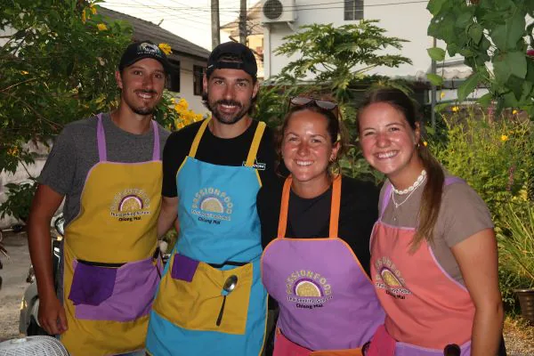 A small group of students in aprons at the school
